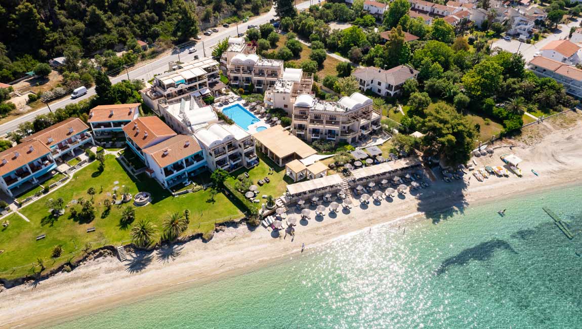 Aerial view of Fourka Beach in Halkidiki with turquoise waters and beachfront accommodation